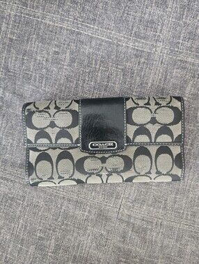 Vintage Coach signature monogram canvas and leather long wallet.